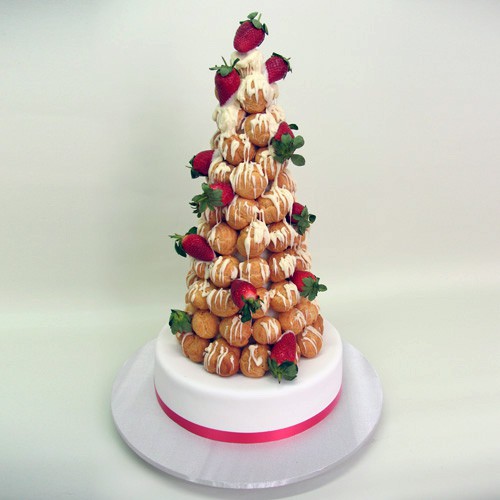 Profiterole on Cake And Strawberries Profiterole